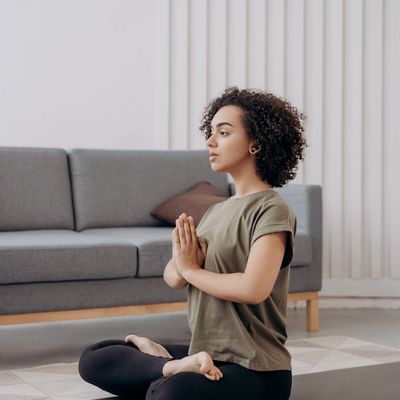 A person meditating in a comfortable seated position.